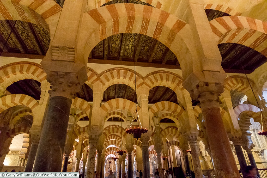 Admire the arches, Mezquita – Mosque–Cathedral, Córdoba, Sp