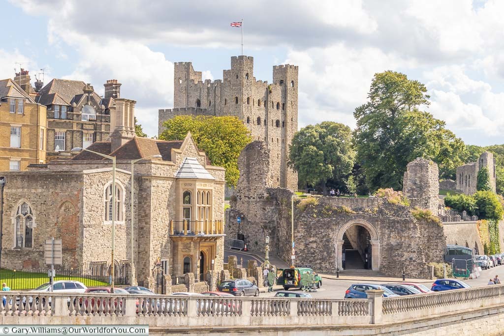 View from Rochester bridge overlooking the promenade and the entrance to Rochester Castle with the Keep high on the hill above.