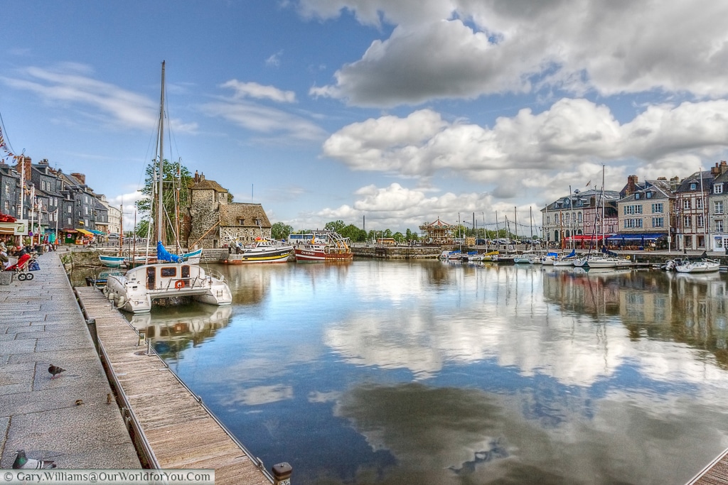 A view of the harbour featuring The Lieutenancy & carousel in the distance, Honfleur, France