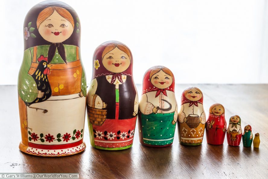 The Matryoshka Dolls lined up from tallest to smallest, left to right.