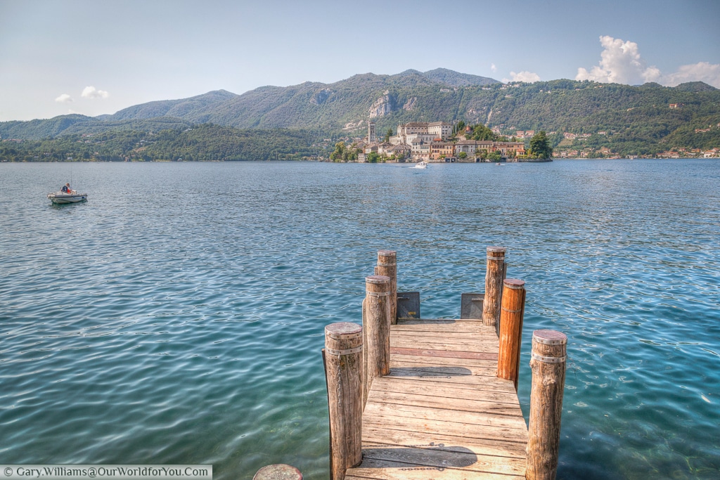 The view from the lakeside to the small island of Isola San Giulio on Lake Orta, Italy