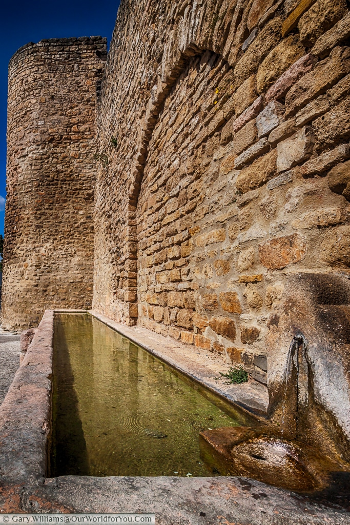 A water trough by the city walls, Ronda, Spain