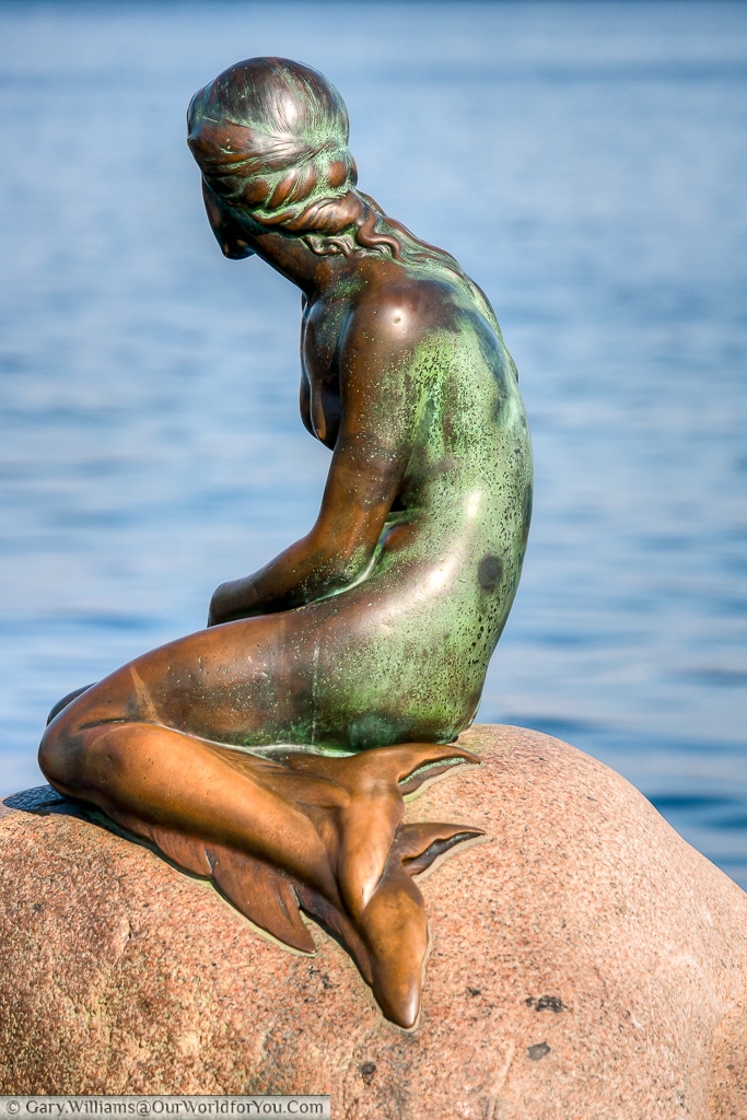 The Little Mermaid looking out to sea, Copenhagen, Denmark