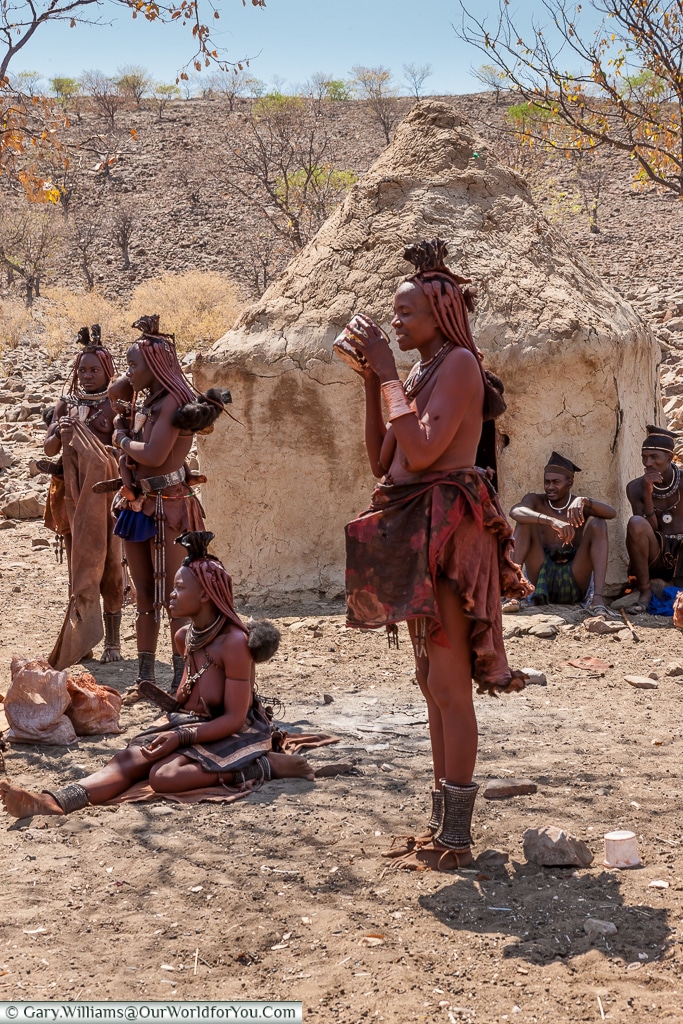 Taking a drink, the Himba tribe, Damaraland, Namibia