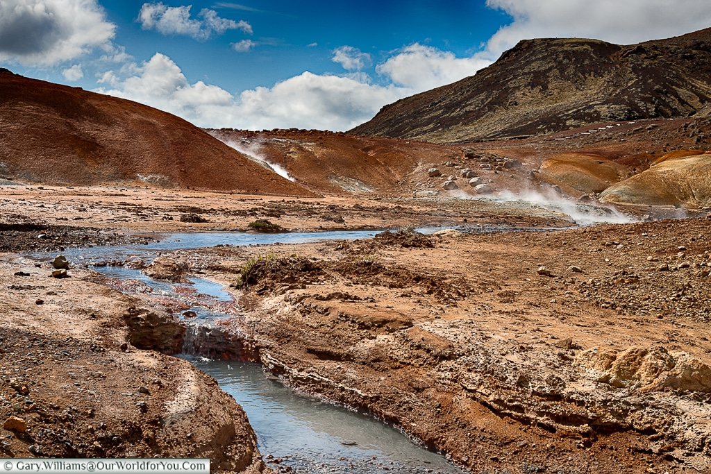 Heat rises from the ground at the Seltún Geothermal Pools, Iceland