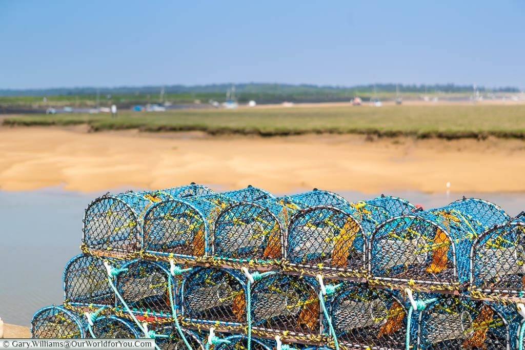 Shellfish baskets stacked up on the quayside of Wells-next-the-Sea on the North Norfolk coastline
