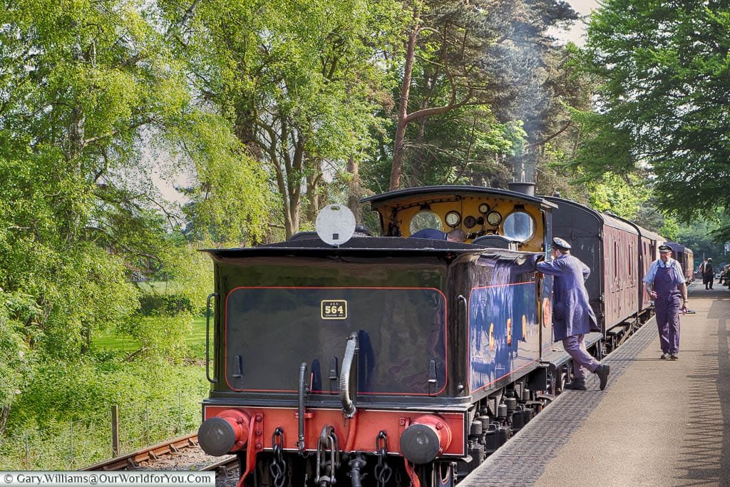 The steam locomotive, number 564, waiting at Holt station on the North Norfolk Railway line.