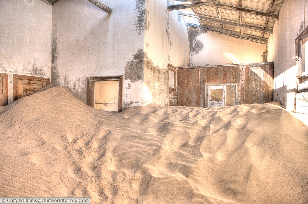 Sand dunes in the buildings of Kolmanskop, Namibia