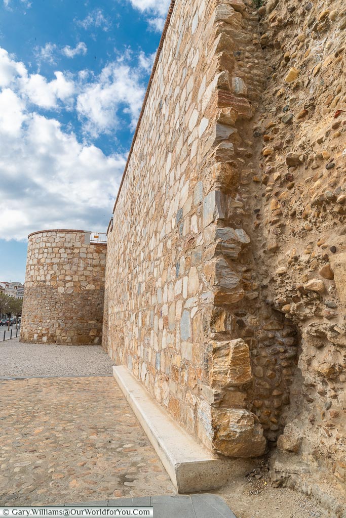 The rough, thick, stone city walls of León, Spain