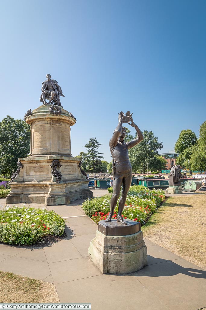 A bronze statue to Shakespeare's Prince Hal, holding his crown aloft, in the Bancroft Gardens in Stratford-upon-Avon