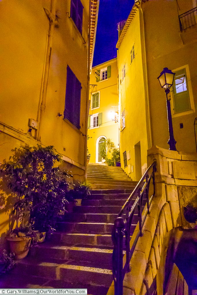 Steps leading up to a courtyard in Villefranche-sur-Mer at night