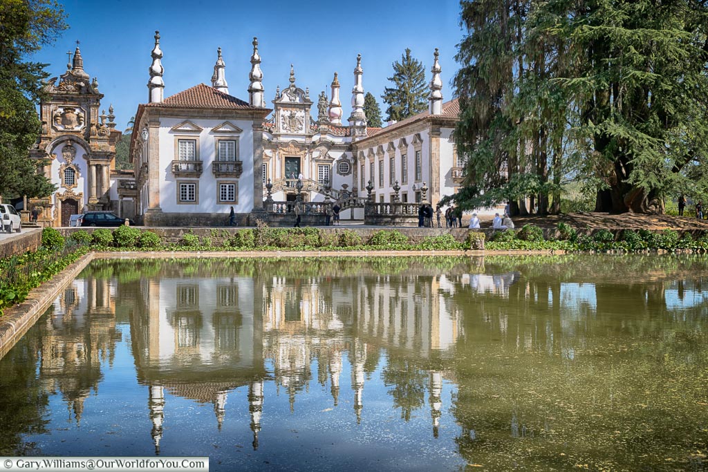 The Casa de Mateus, a baroque palace in the north of Portugal, reflected in the pond in front of it.