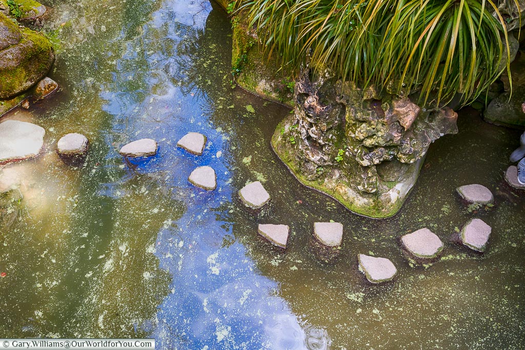 Stepping stones across the Lake of the Waterfall, Quinta da Regaleira, Sintra, Portugal