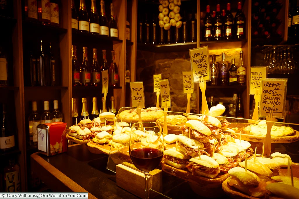 At the bar of pintxos bar in Bilbao, with a selection of the different types of food available.