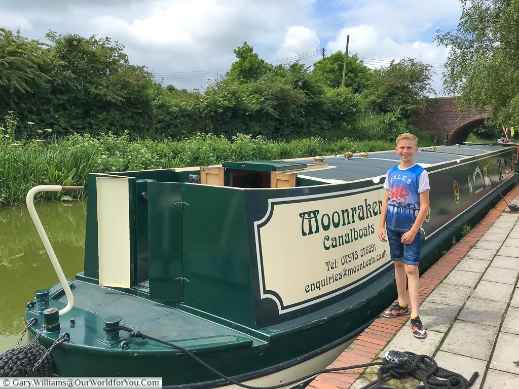 My nephew, Will, at the age of 12, standing next to the bow of Moonbeam, our canal boat from Moonraker.