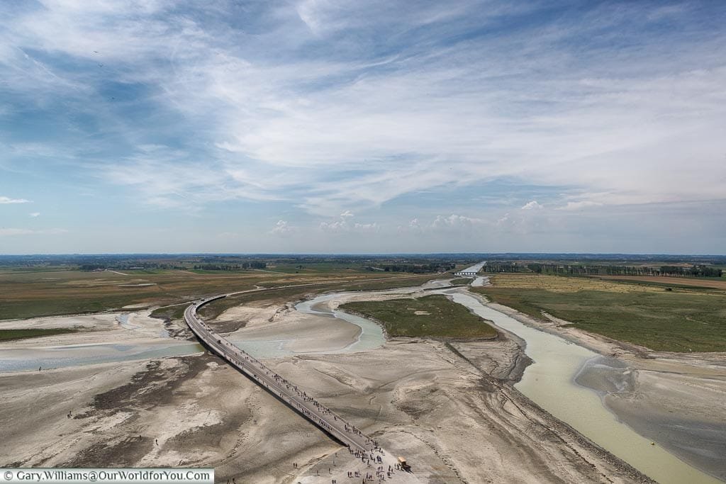 The view of the causeway, and the sandy shores,  from the top of Mont-Saint-Michel