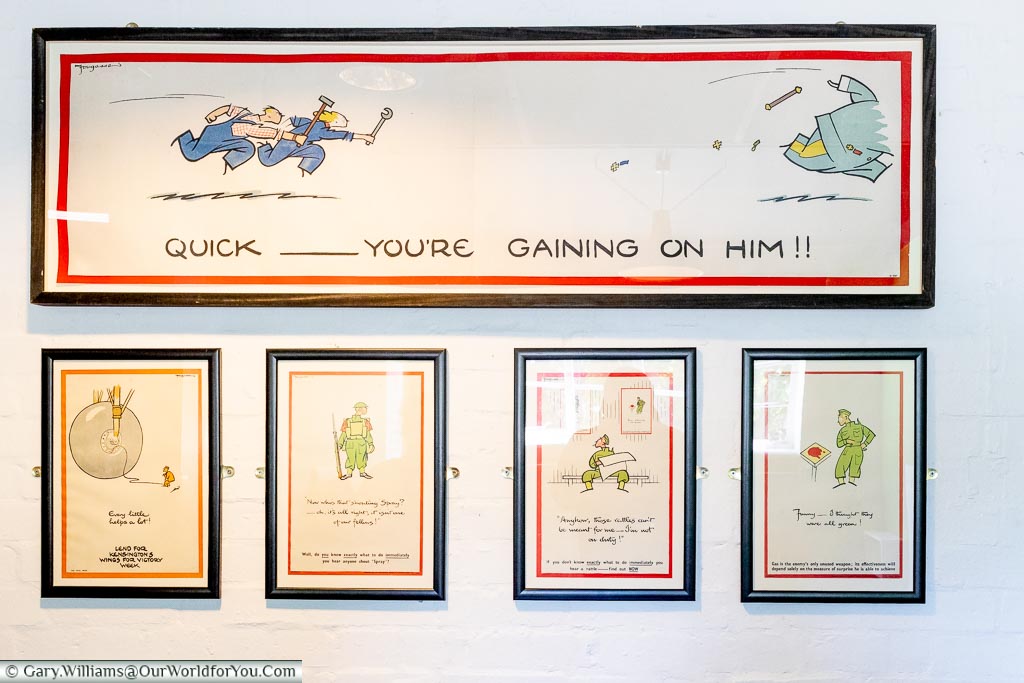 A selection of framed cartoon motivational images from Bletchley Park