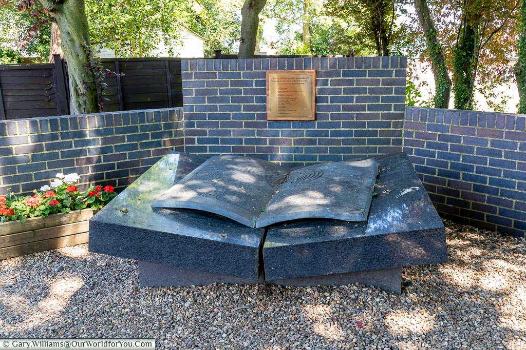 An open book stone memorial at Bletchley Park to the three Polish mathematicians who handed over their work on the Enigma code at the start of the war.