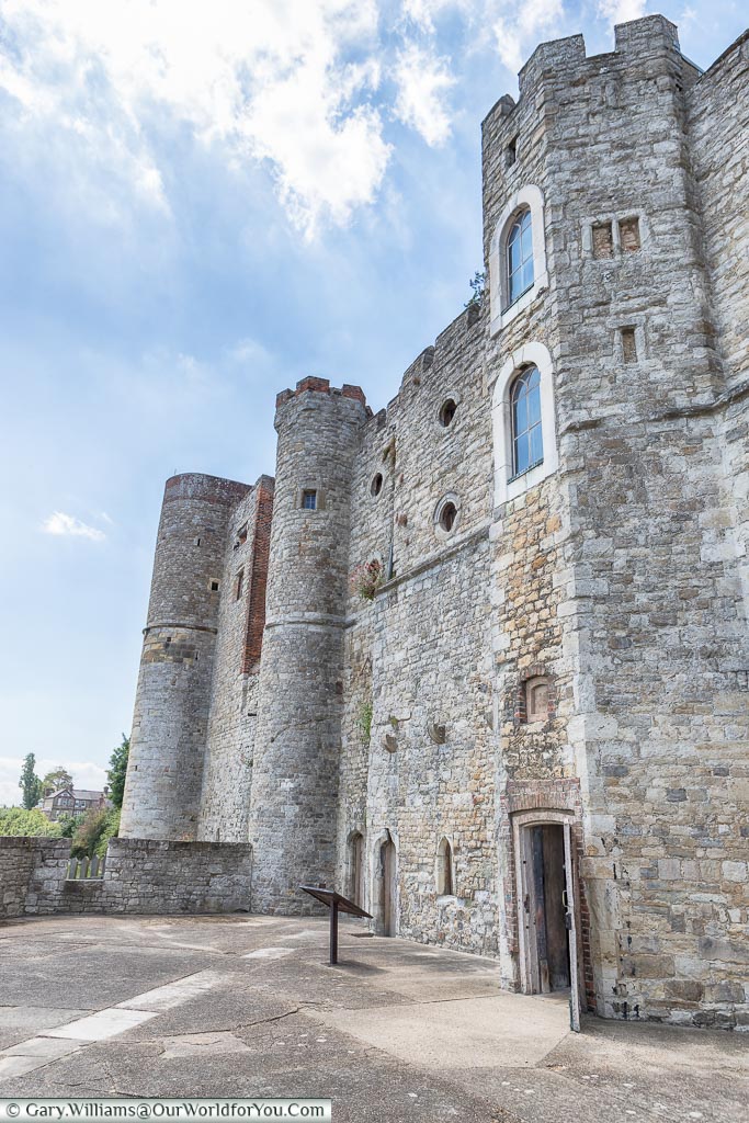 The stone facade of Upnor castle from a courtyard on the riverside