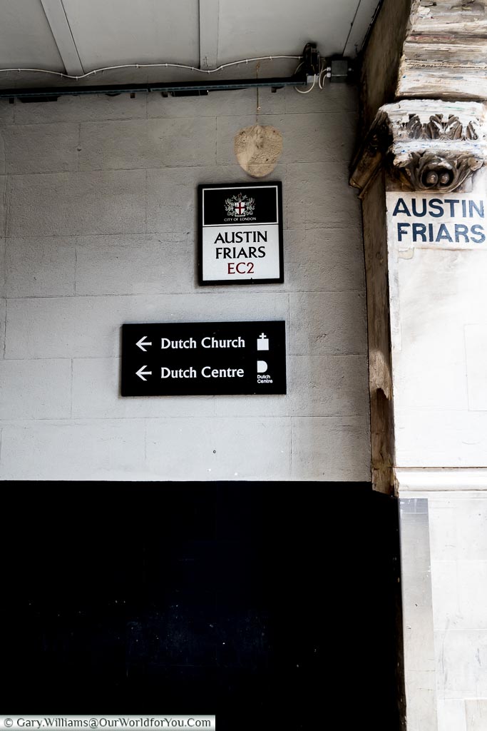 A modern sign for Austin Friars Passage, that leads to the Dutch Church & Dutch Centre, in the City of London.
