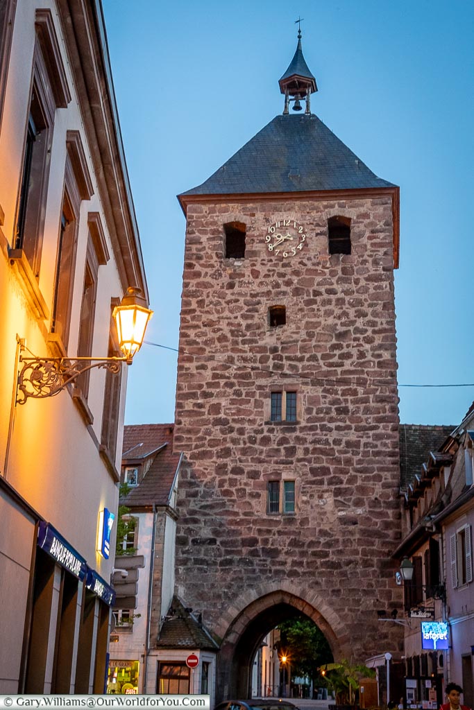 The historical tower, Porte des Forgerons, at dusk.