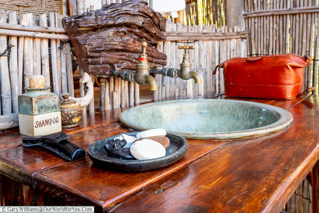 The open air wash stand in our lodge with a soap dish in the foreground.