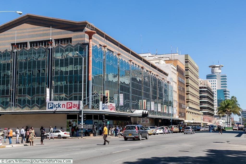 A street scene in downtown Harare that shows a modern, bustling, city centre.