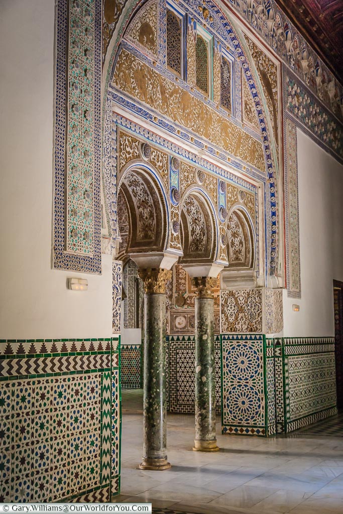 Moorish arches within the Alcazar of Seville.