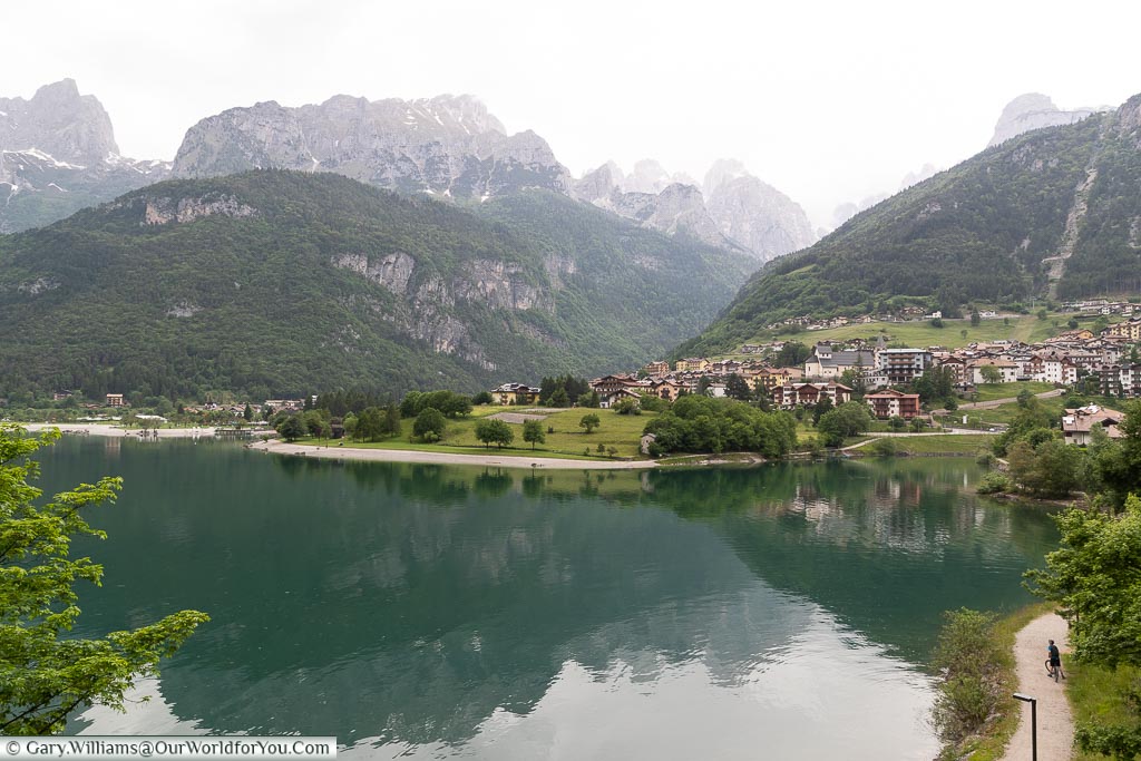 A look over Lake Molveno, and the town of the same name, with mountains in the background.