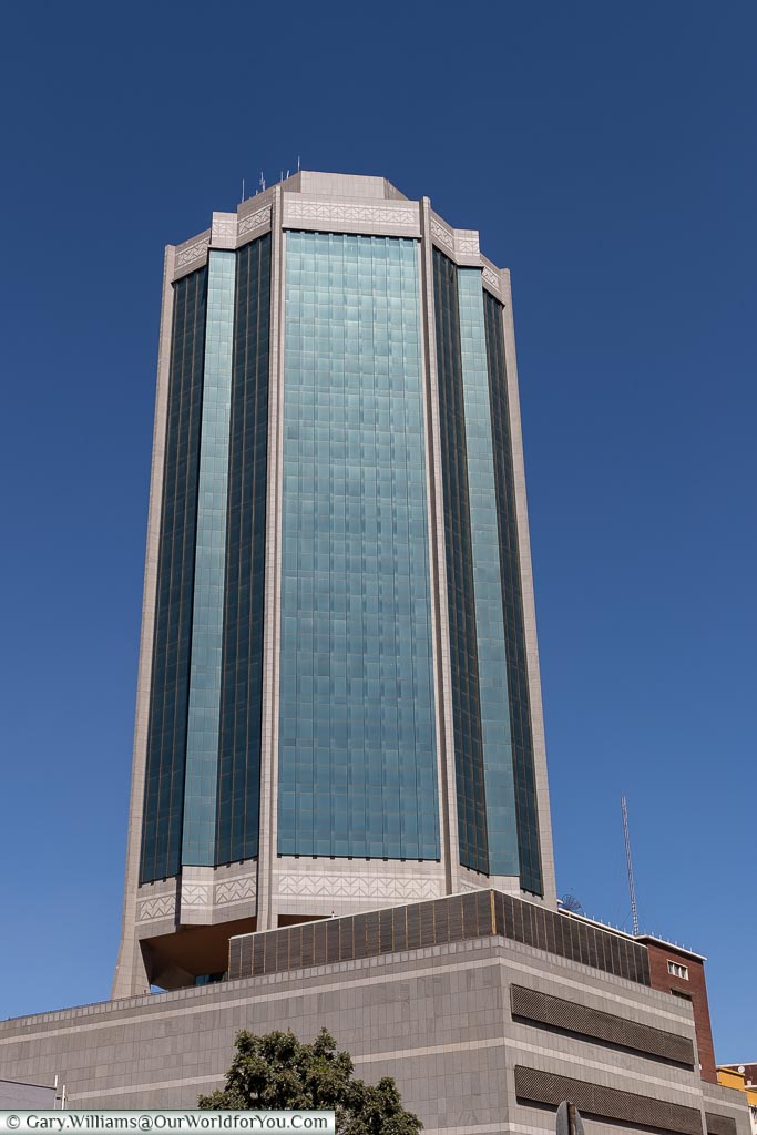 A modern glass tower block of the New Reserve Bank in the centre of Harare.