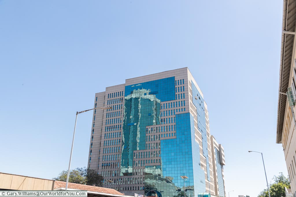 A stone & glass tower block in downtown Harare.