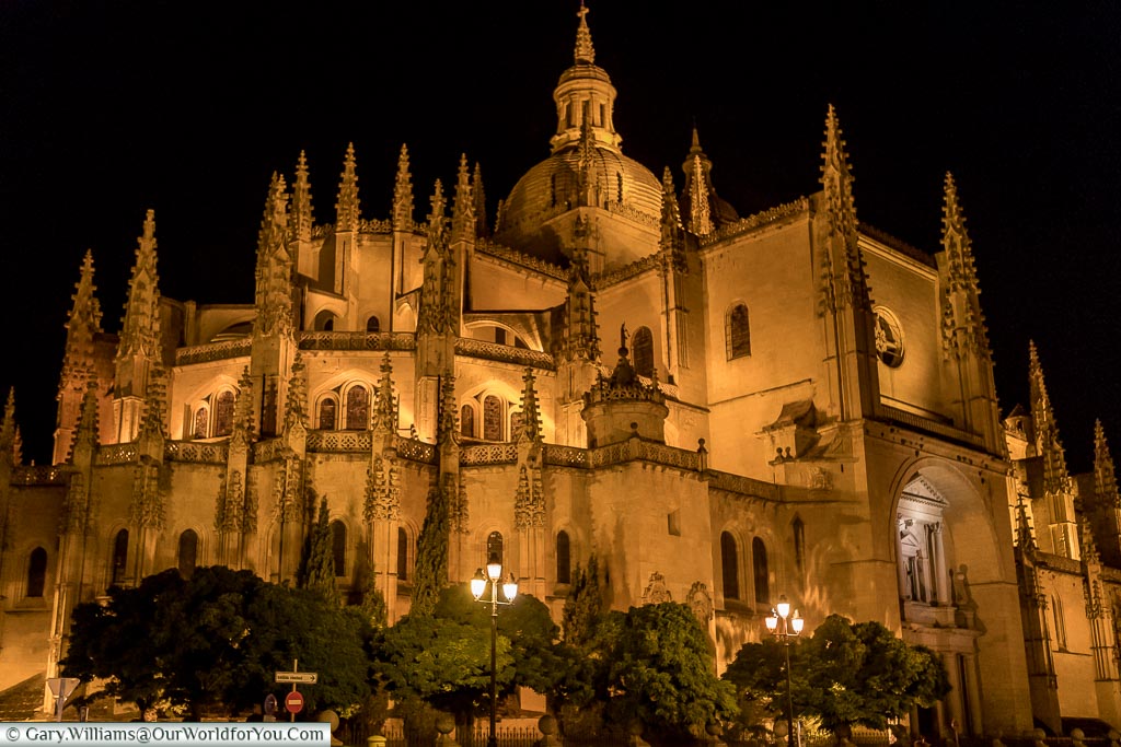 Segovia's cathedral illuminated at night.