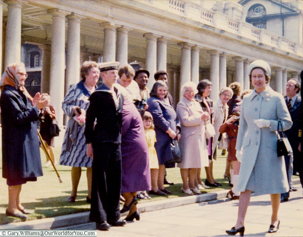 The Queen strolling through Greenwich Naval College in the '70's in front of a group of onllokers including me.