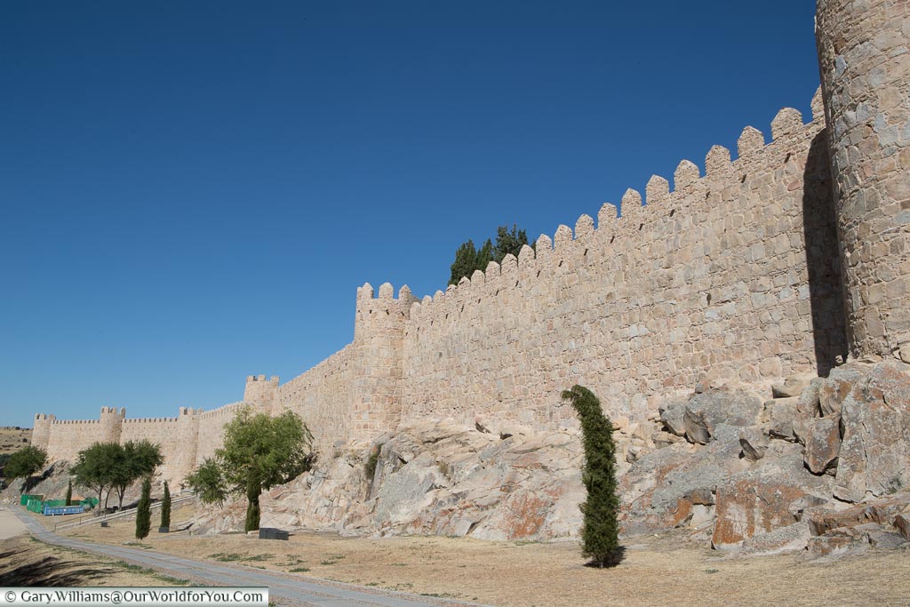 The exterior of old city walls of Ávila with 6 of its famous towers on show.