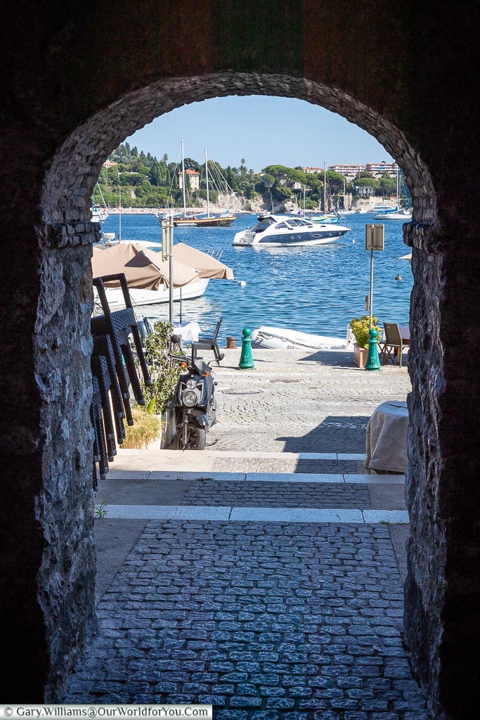 Looking through an arch to the bay of Villefranche-sur-Mer.