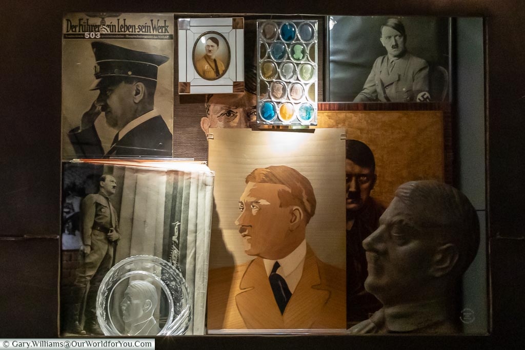 A collection of images, photos and a bust of Adolf Hitler.