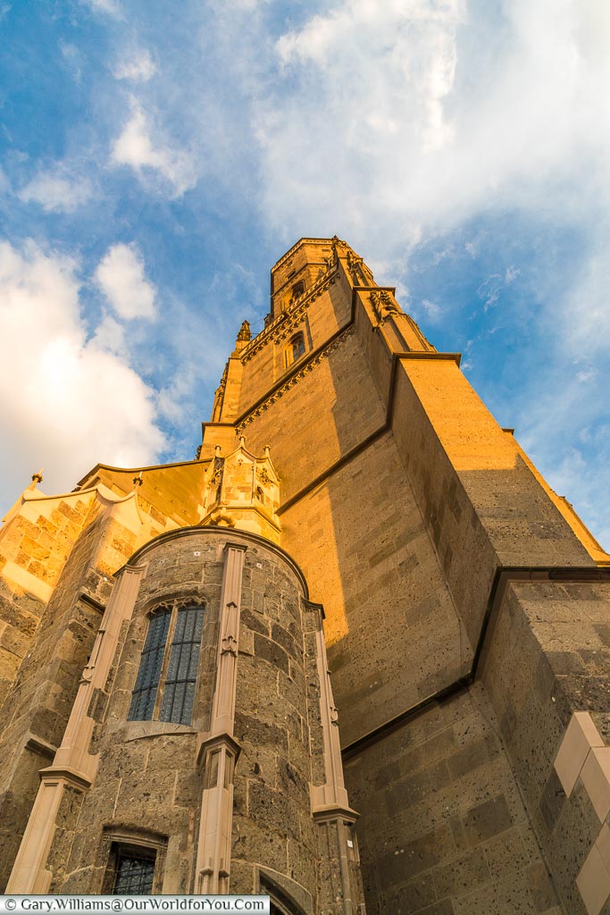 Looking up at the Daniel Tower of St George’s Church caught in the golden light evening.