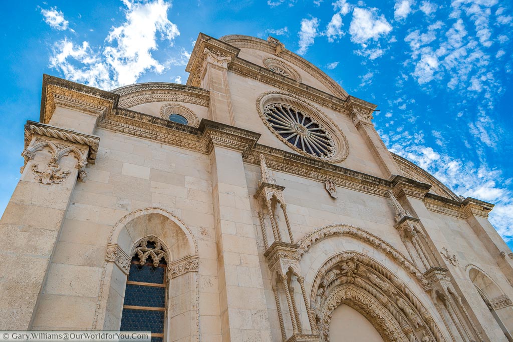 Looking up at the ornate facade of the Cathedral of St James in Šibenik.