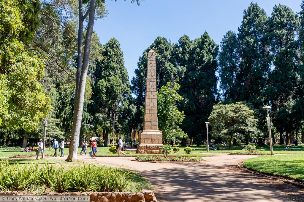A large stone block obelisk in the centre of the Harare Gardens.
