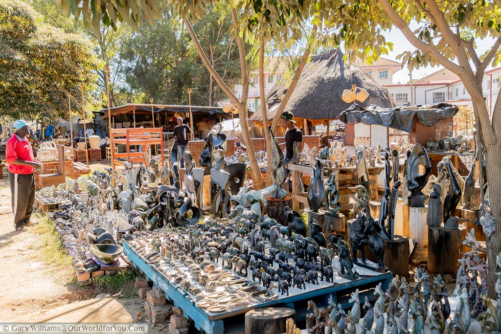 A collection of stalls displaying carved stone ornaments.
