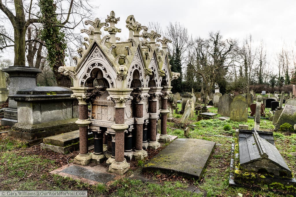 The raised tomb of Commander Charles Spencer Ricketts, of the Royal Navy, with its ornate canopy in  Kensal Green Cemetery