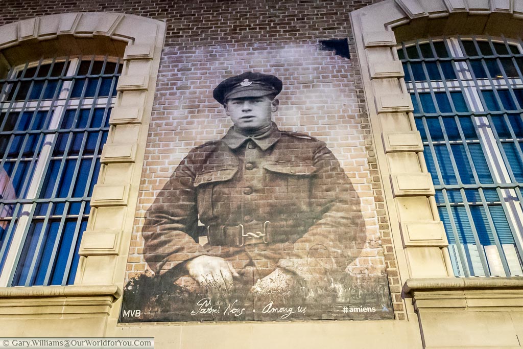 A detailed picture of an allied soldier from the first world war on a building on Amien on the river Somme.