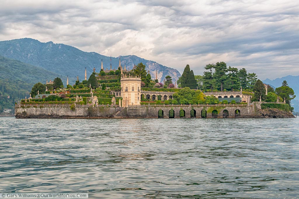 The small island of Isola Bella as seen from the ferry.  This view is over the ornate tiered Italian gardens that are a feature of the island.