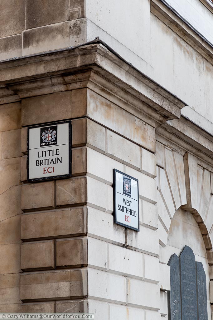 A street sign for the street known as Little Britain on a column on the corner with West Smithfield.