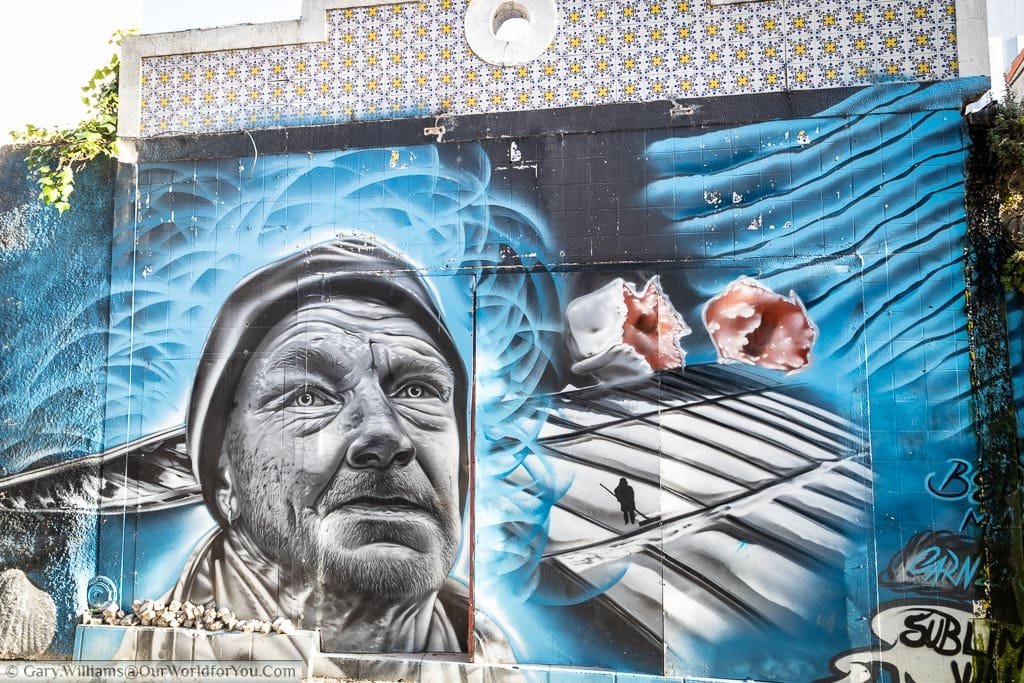 A mural on a rugged-looking sailor who works the salt pans in Aveiro, Portugal.