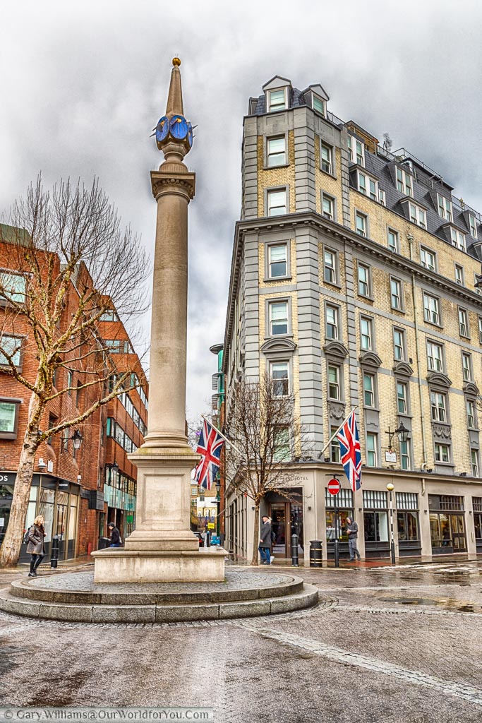 The column at the centre of Seven dials.  A junction where seven roads meet.  Don't count the dials at the top of the column as you will notice there are only 6.