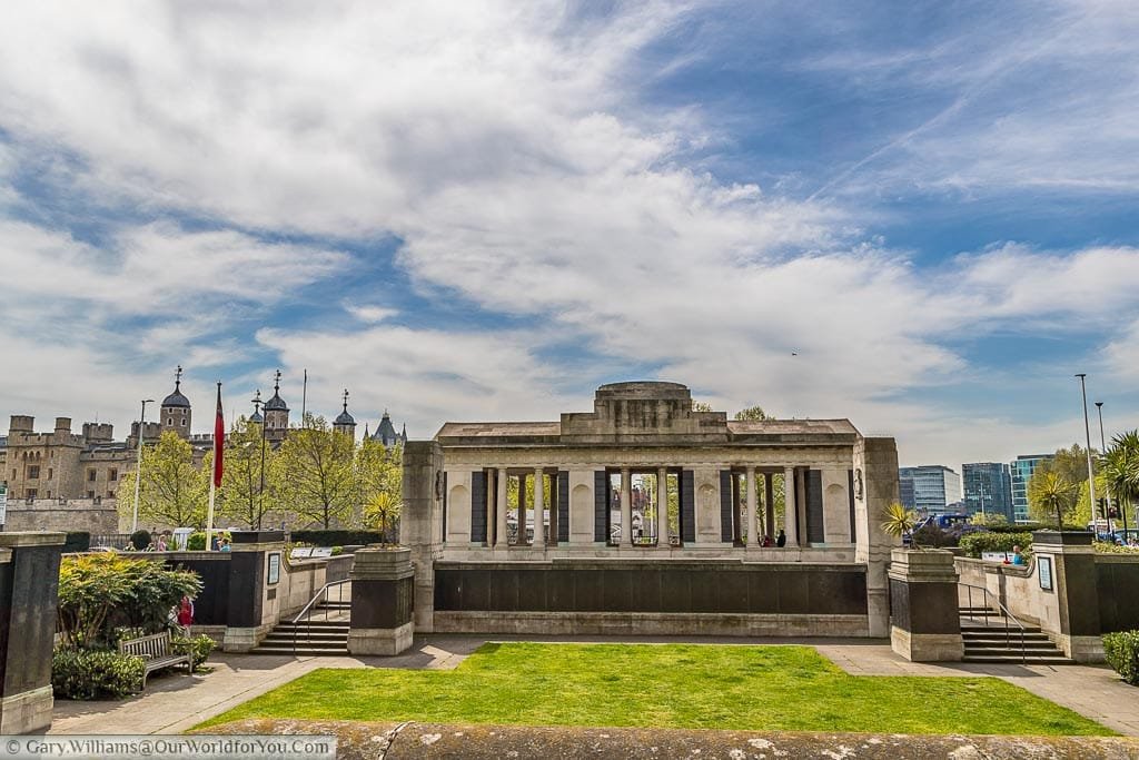 Overlooking Tower Hill Memorial Gardens towards the memorial colonnade to the fallen from World War One with the Tower of London in the background.