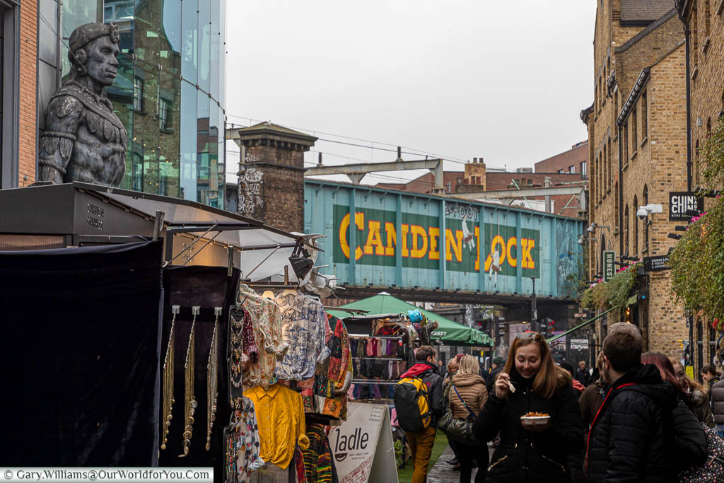 A view of the Camden Lock sign painted on the railway bridge at the Camden Lock Place entrance to Camden Market.