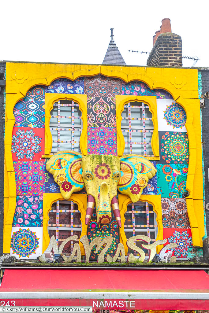 A bold facade, featuring an Elephant's head motif decorated in traditional Indian design, above a restaurant called 'Namaste' in Camden