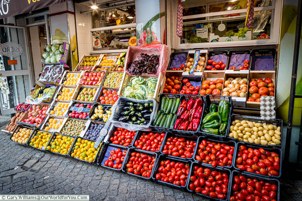 Fruit and vegetables stacked up outside a stall at the Mercado de Feria in Seville, Spain